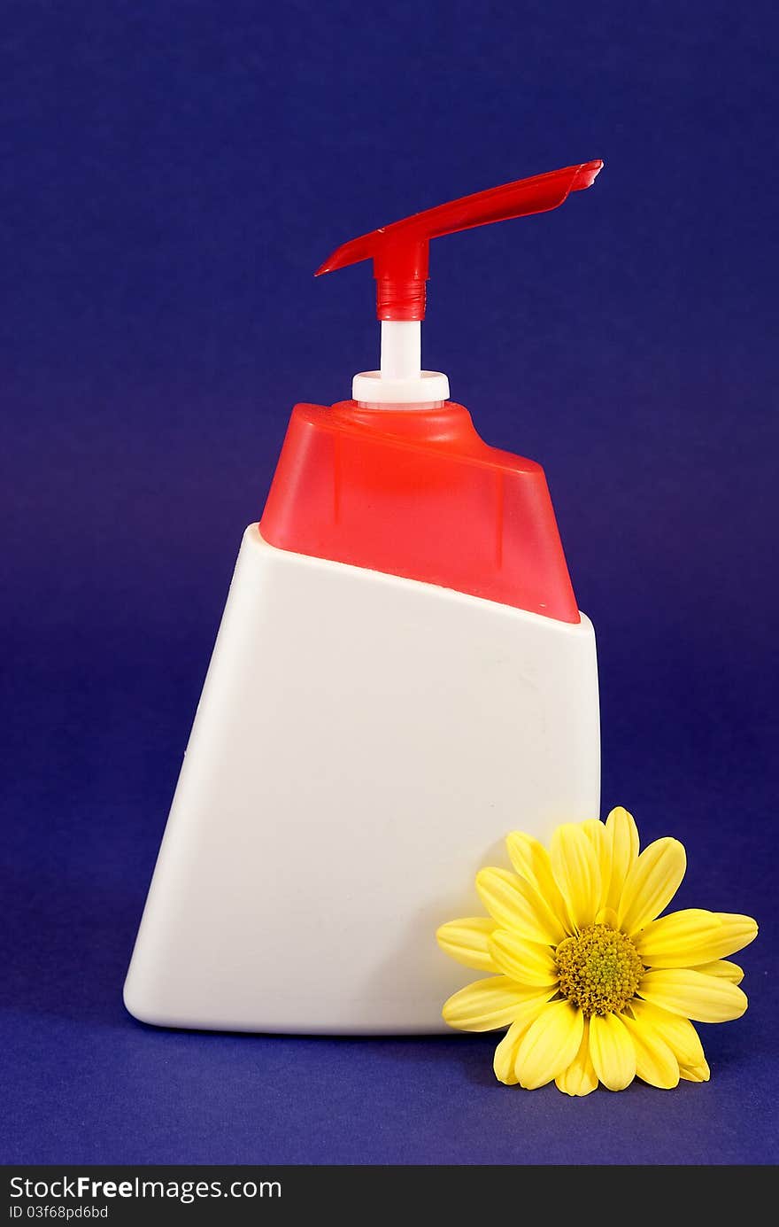 Container of liquid hand soap on a blue background. Container of liquid hand soap on a blue background