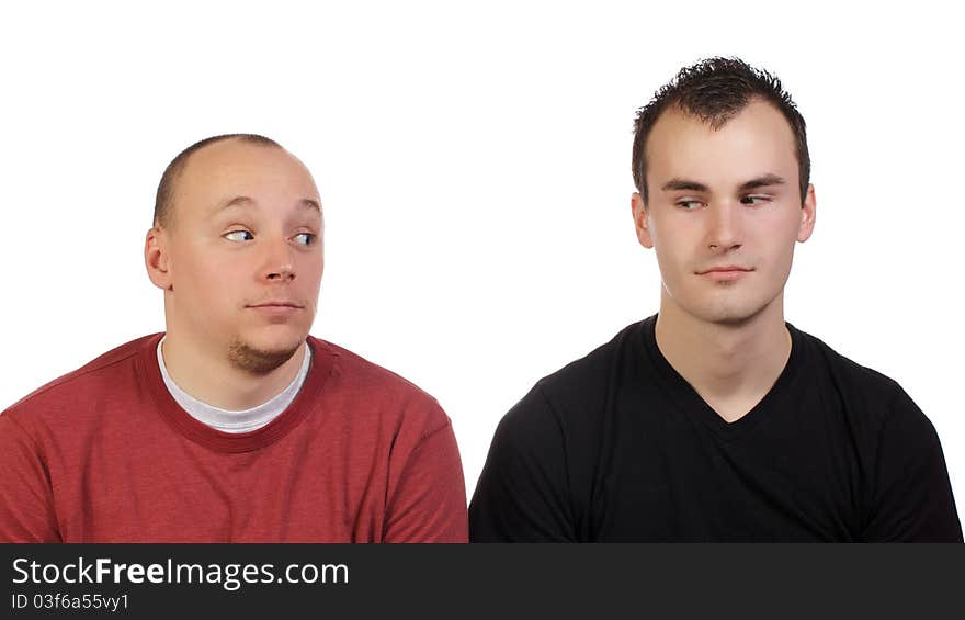 Young men goofing around and being silly for a studio shot. Young men goofing around and being silly for a studio shot