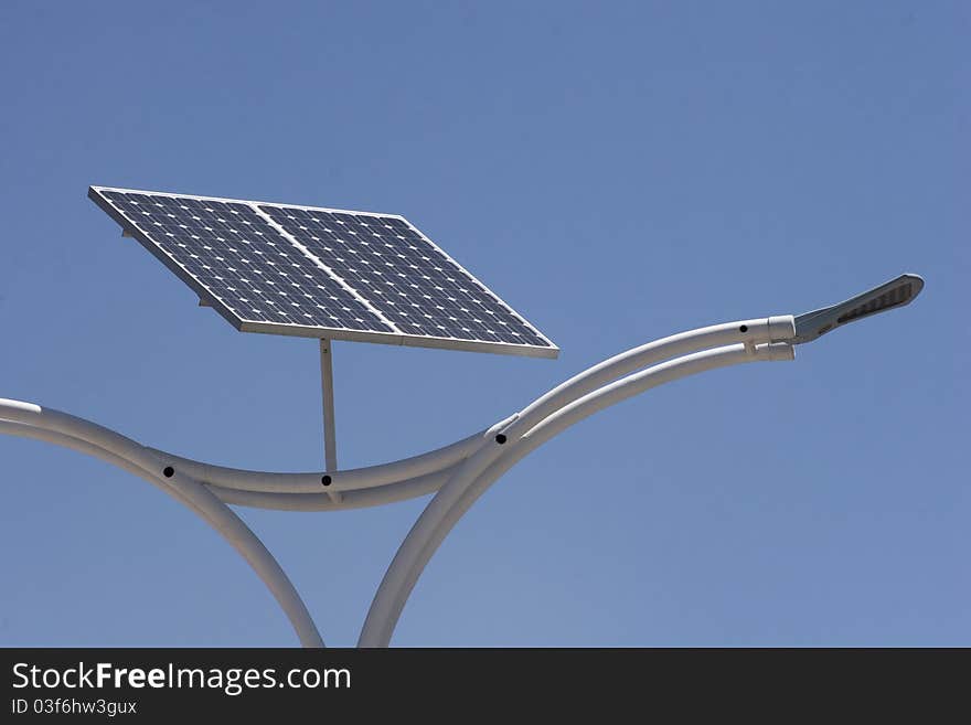 Street light with solar panel energy over blue sky. Street light with solar panel energy over blue sky