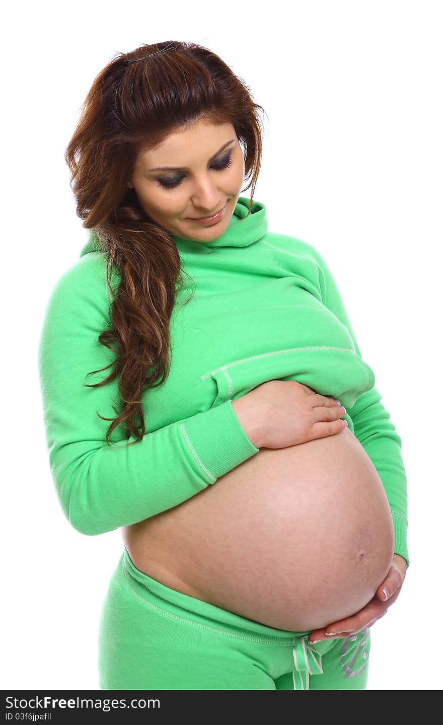 Pregnant Woman standing and holding her belly isolated on white. Pregnant Woman standing and holding her belly isolated on white