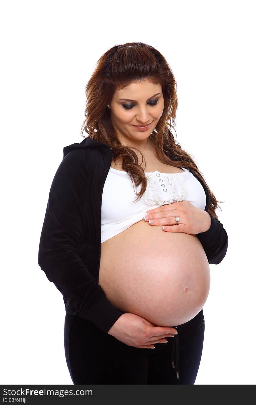 Pregnant woman holding her bare belly