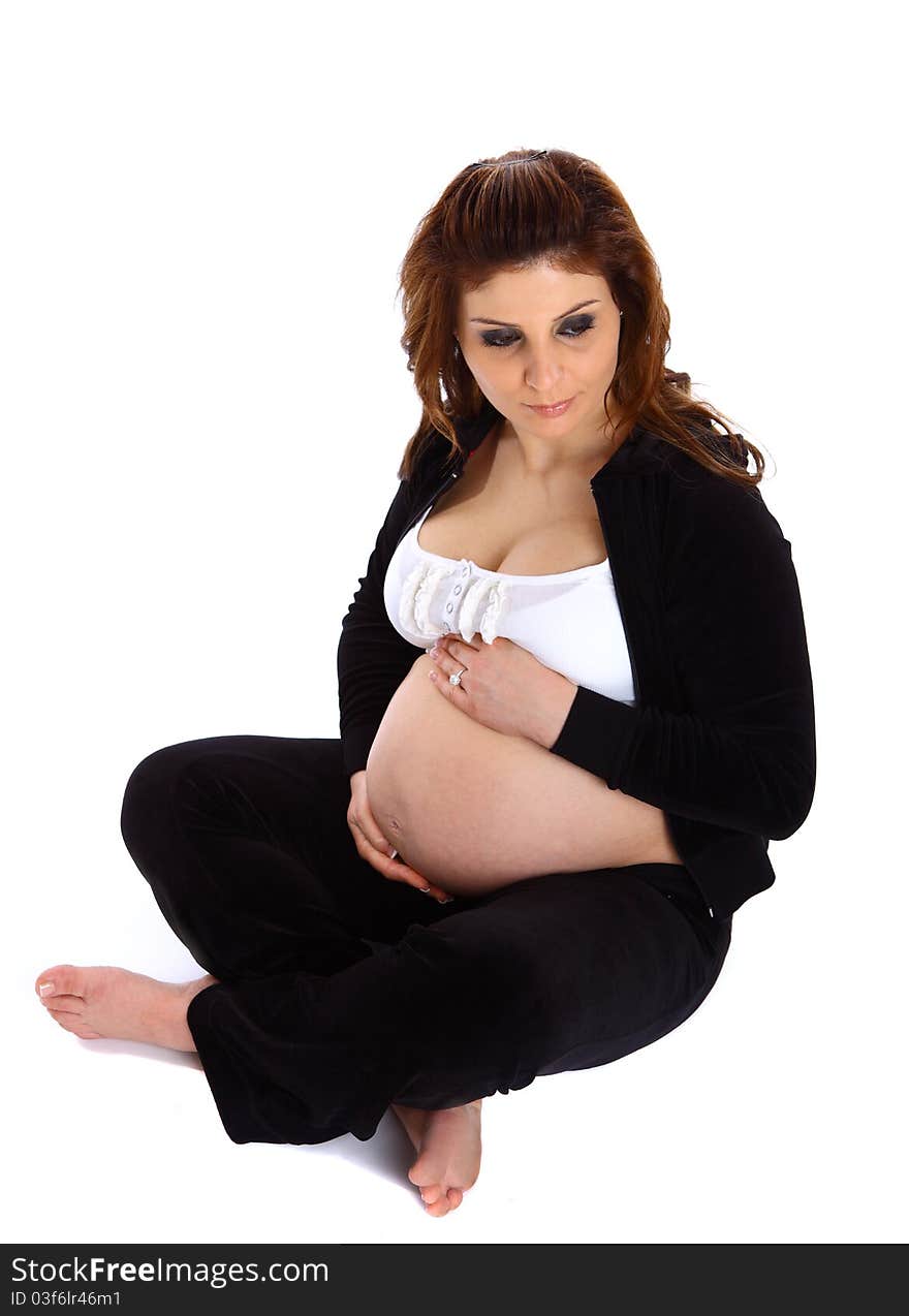 Pregnant woman sitting on the floor