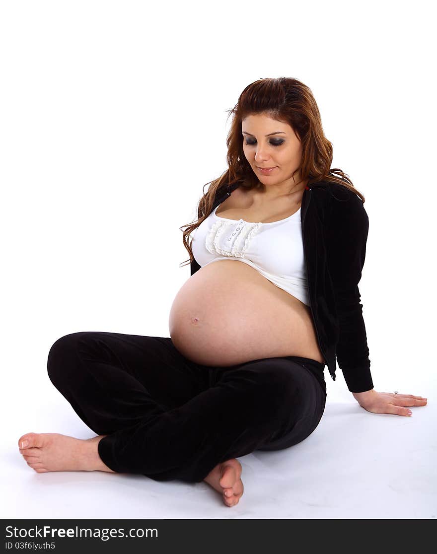 Pregnant Woman Sitting On The Floor