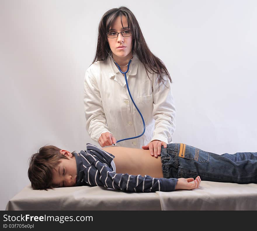 Female pediatrician visiting a child