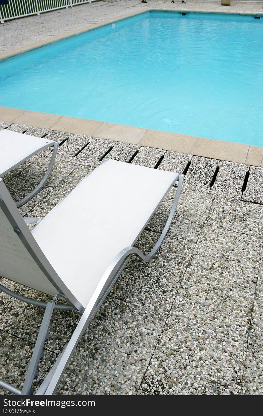 Furniture recliner gardens around a pool