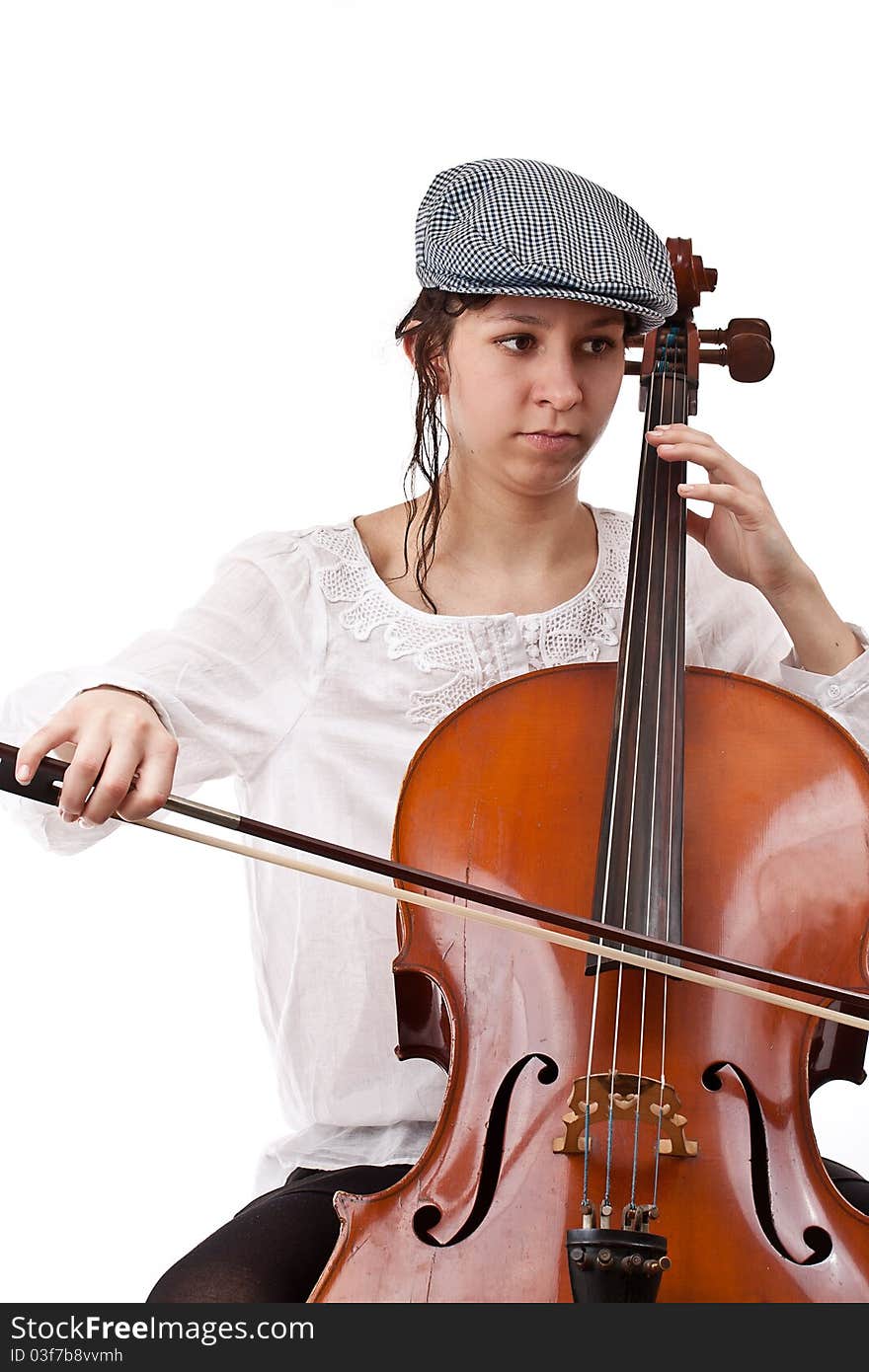 Young cellist siting and playing cello on white background. Young cellist siting and playing cello on white background