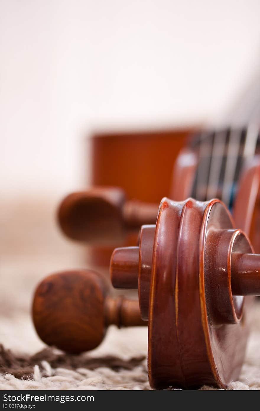 Detail of a classical cello in white background