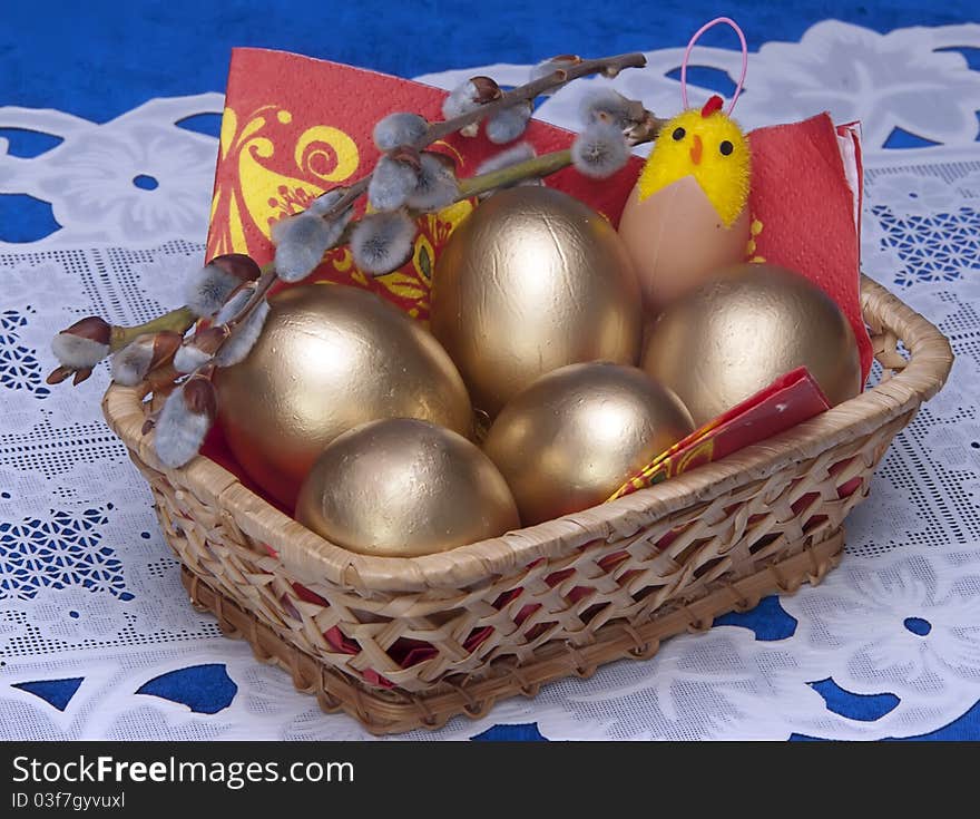 Easter gold eggs and branch of willow. Easter gold eggs and branch of willow