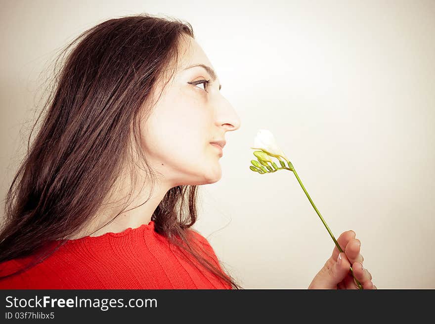 Portrait of a beautiful Girl with a Flower