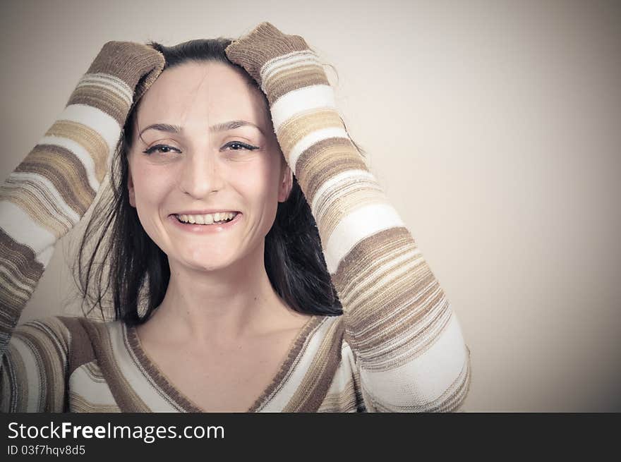 Portrait of a beautiful girl with long hair laughing
