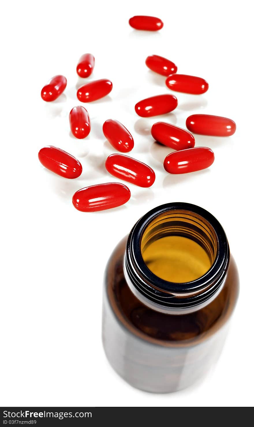 A Bottle of red pills for joy on a white background with space for text