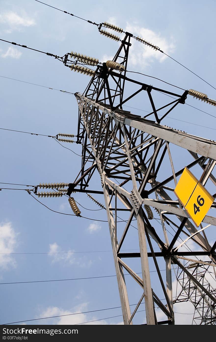 High Voltage lines against the background of the cloud of blue sky