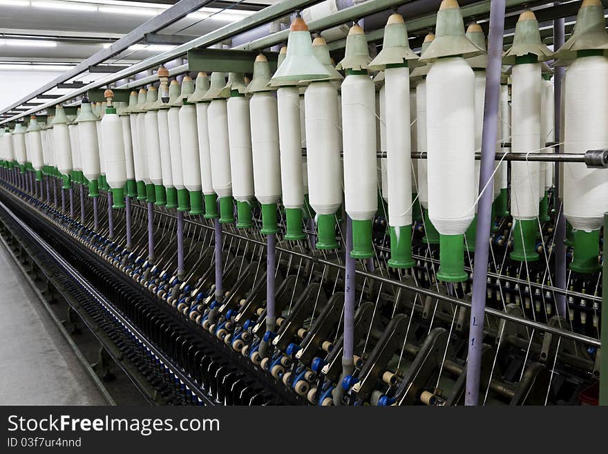 Cotton chord spools in a textile factory