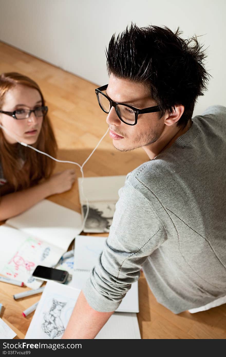 Beautiful young couple listening music. Beautiful young couple listening music.