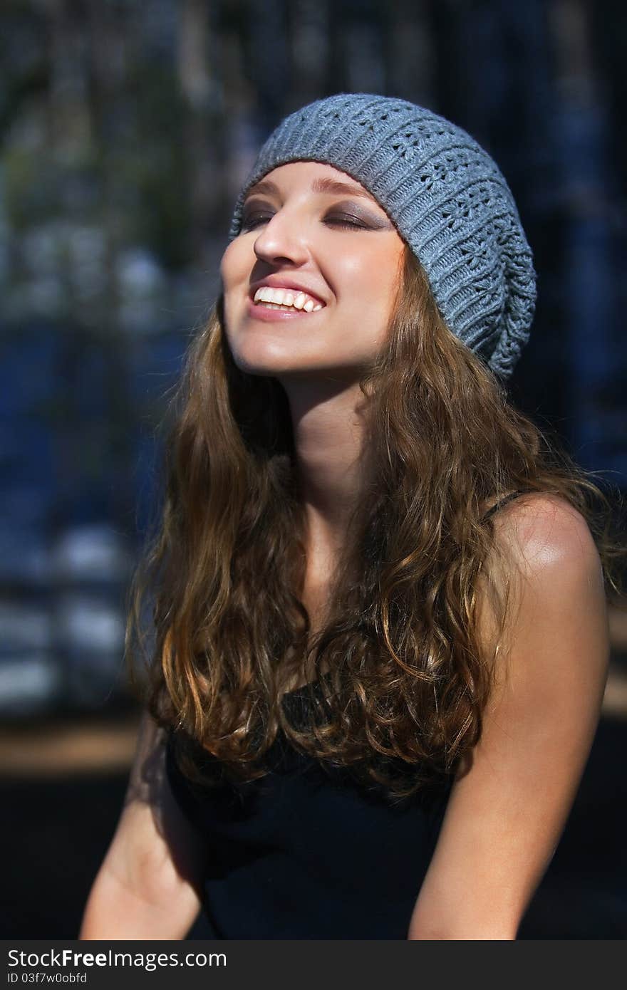 Beautiful smiling girl in a blue beret