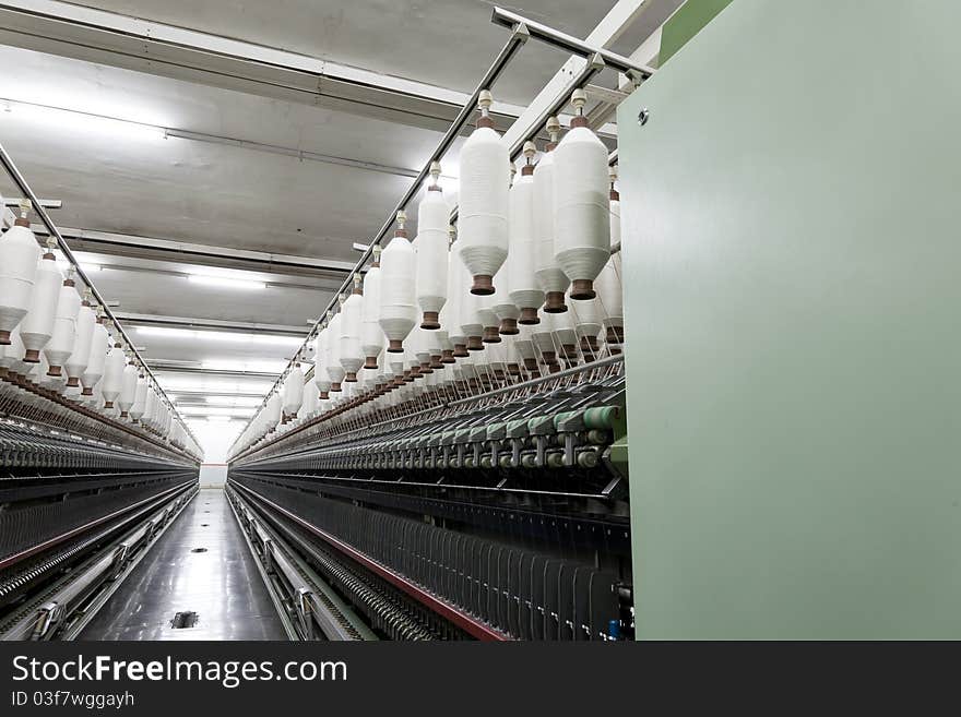 Cotton chord spools on roving machine