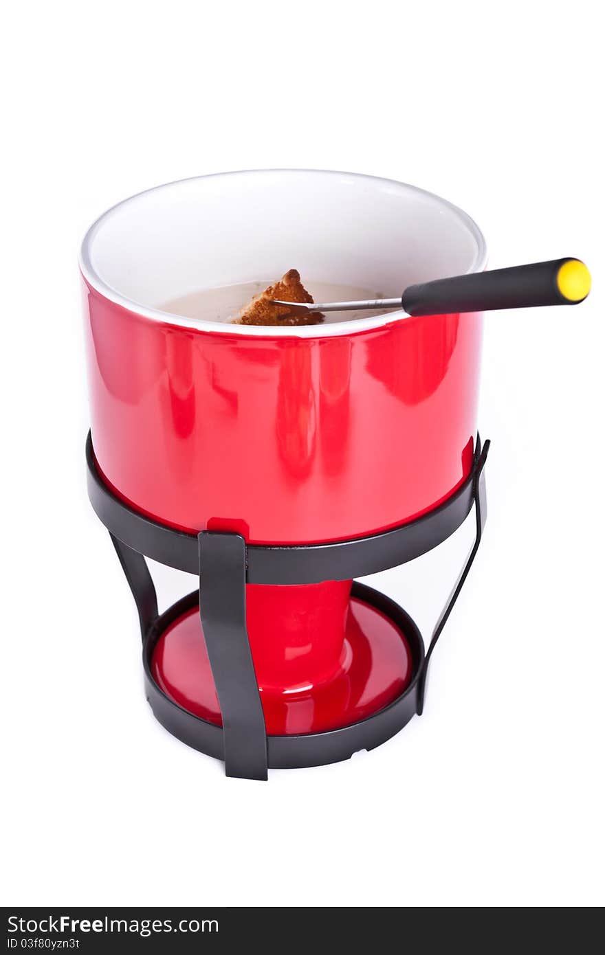 Fondue pot with fork and bread