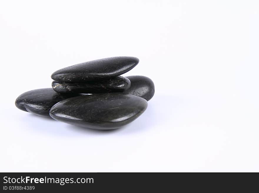 Spa stones on a white background