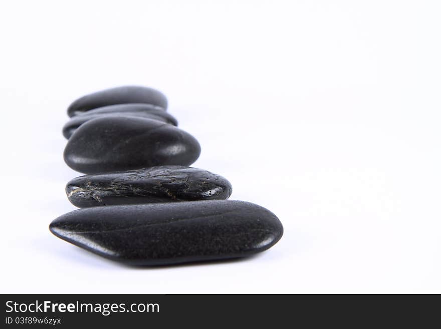 Spa stones on a white background