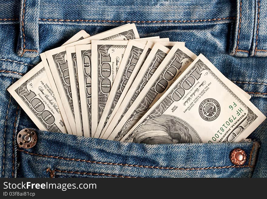 American dollar bills in jeans pocket