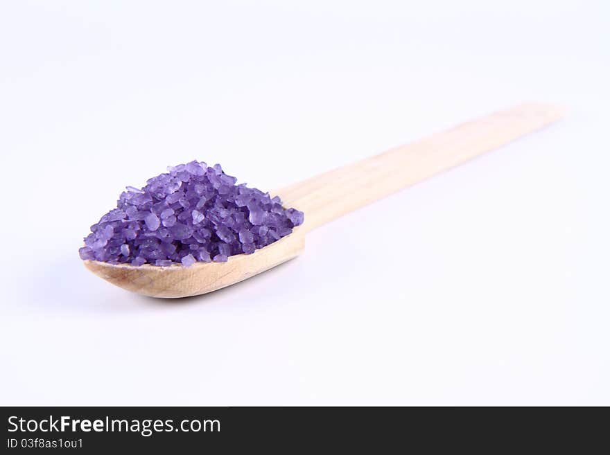 Lavender spa salt on a wooden spoon