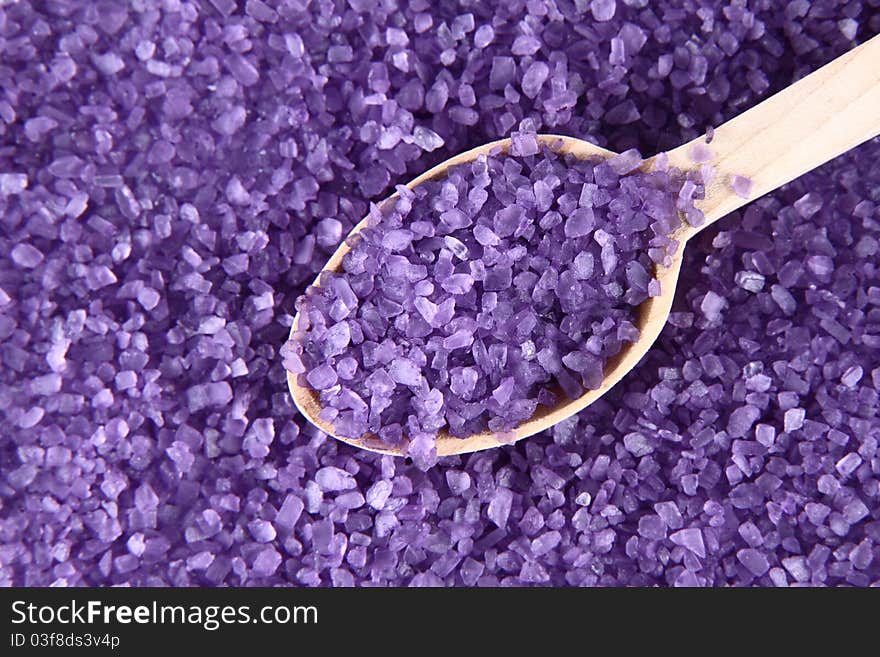 Lavender spa salt, some on a wooden spoon