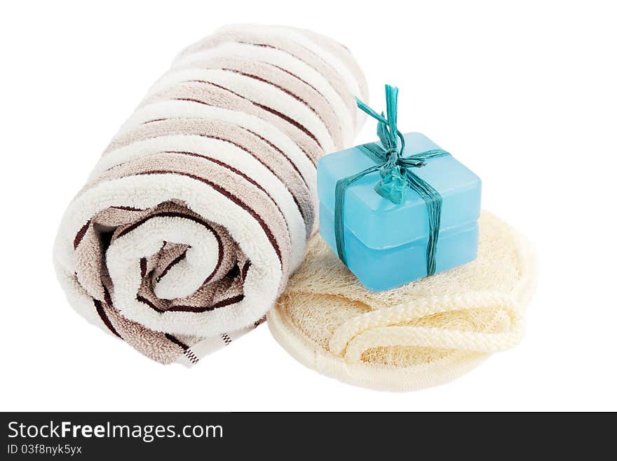 Bath equipment - washed, washcloth, towel on the white