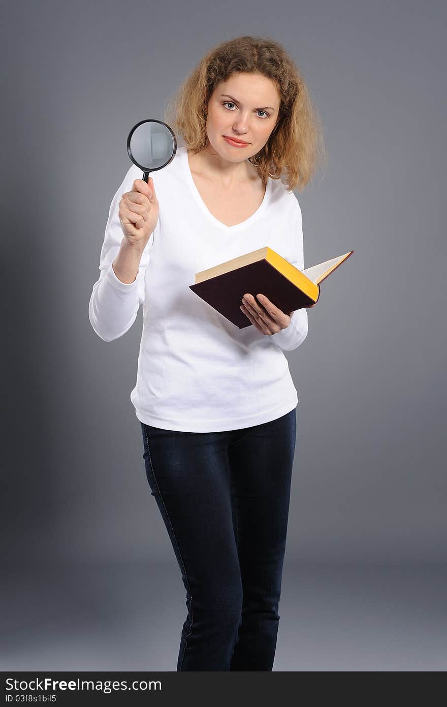 Woman Looking The Book With Magnifying Glass