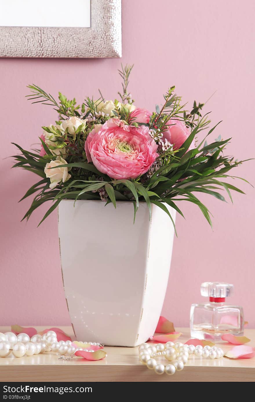 Bouquet of pink roses with pearl necklaces on pink background. Bouquet of pink roses with pearl necklaces on pink background