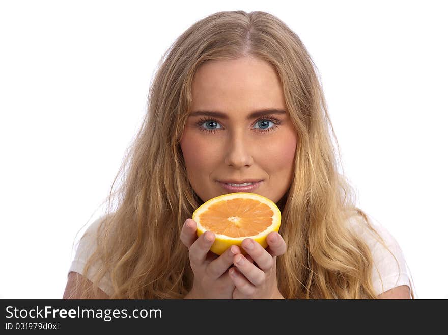 Beautiful caucasian woman holding grapefruit