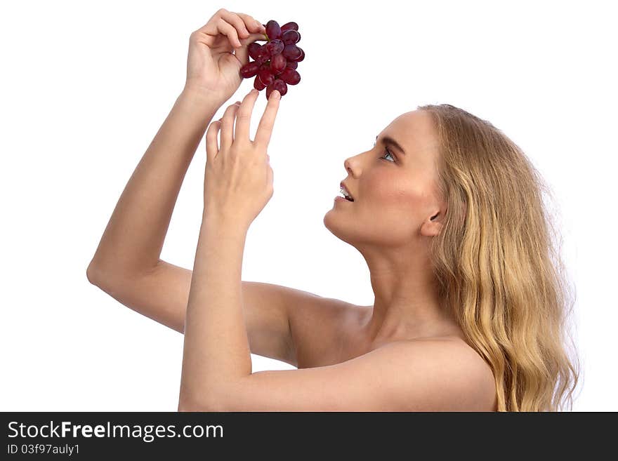 Sexy caucasian woman holding red grapes