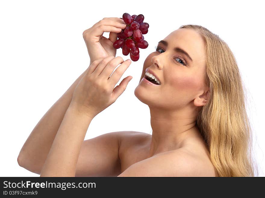 Sexy caucasian woman holding red grapes