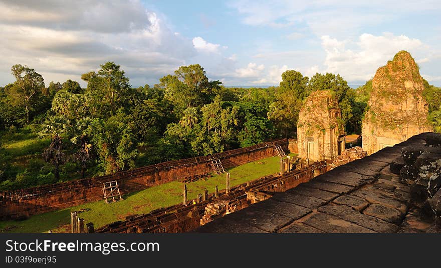 This is Pre Rup temple in Angkor. The building was ruined. The temple was aroueded by rain forest. Now it was repaired by international volunteers. The photo was taken when sunset. This is Pre Rup temple in Angkor. The building was ruined. The temple was aroueded by rain forest. Now it was repaired by international volunteers. The photo was taken when sunset.