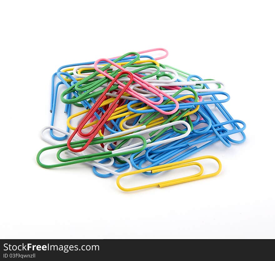 Many large paper clips on a white background. Colorful paper clips.