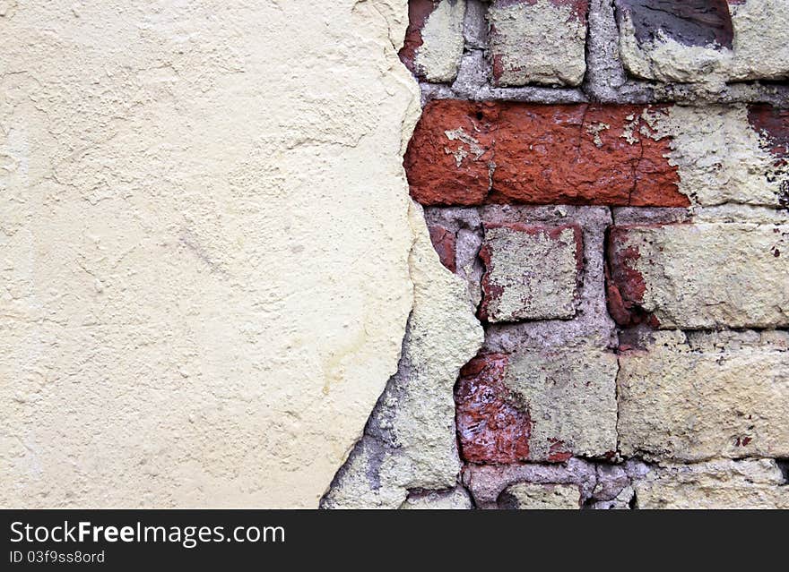 Old grunge stucco over brick wall - abstract background. Old grunge stucco over brick wall - abstract background