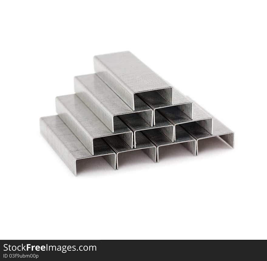 Pyramid with staples on white background