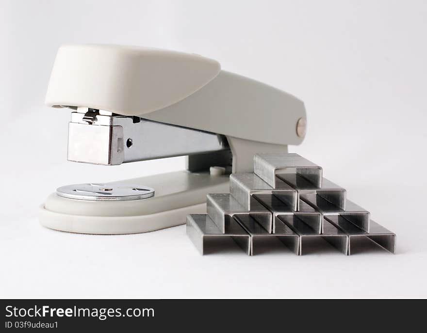 Pyramid with staples on white background