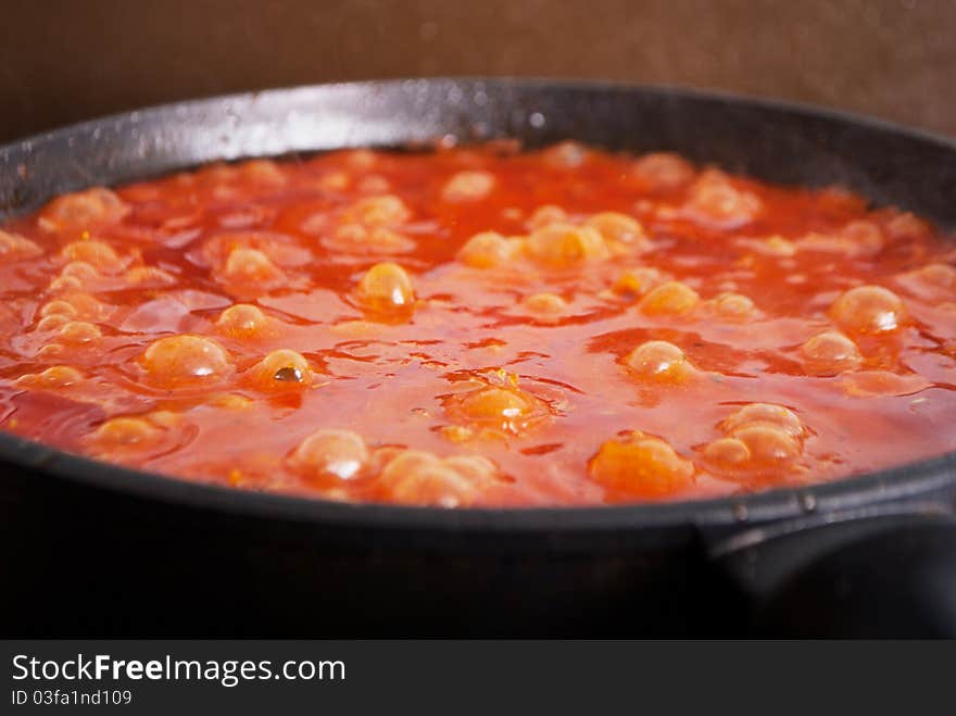 Tasty bolognese sause boiling in frying pan. Tasty bolognese sause boiling in frying pan