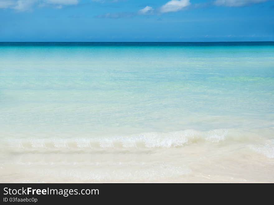 An empty beach, only a rustling sound of the waves