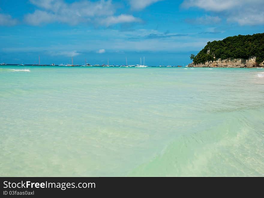 An empty beach, only a rustling sound of the waves