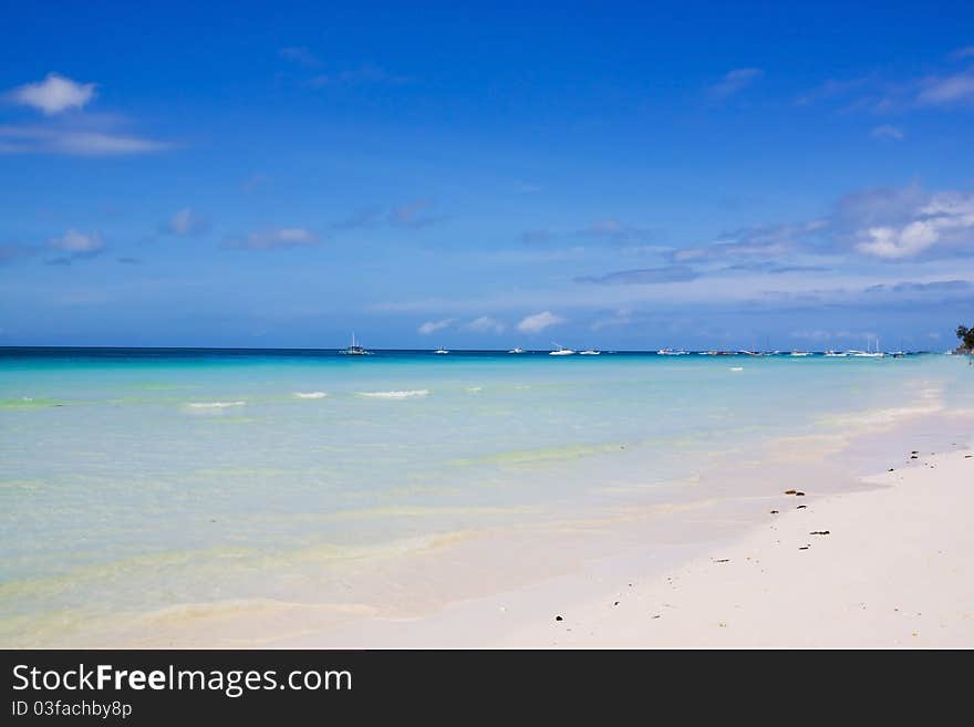 An empty beach, only a rustling sound of the waves