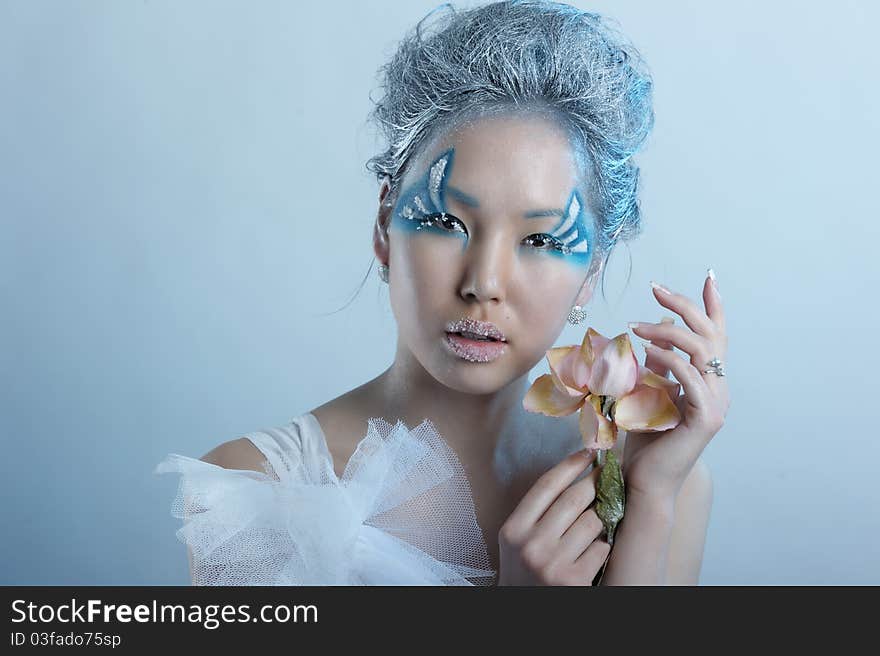 Portrait of woman with creative makeup and flower. Portrait of woman with creative makeup and flower