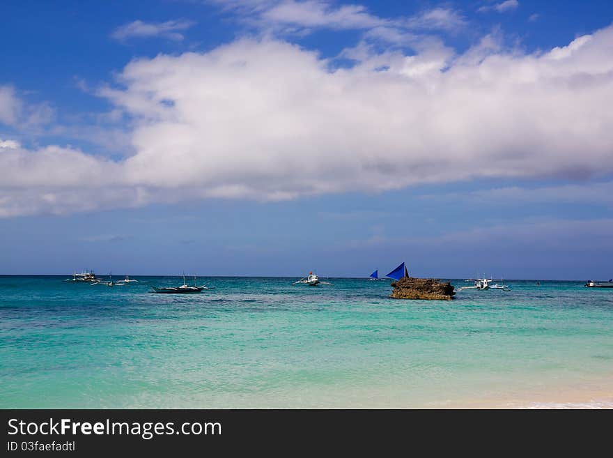 An empty beach, only a rustling sound of the waves