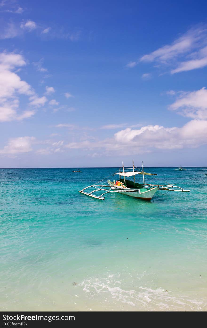 No one in the sea, a solitary sailboat. No one in the sea, a solitary sailboat