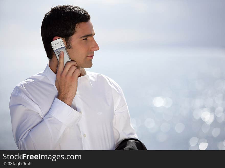 Smart man having phone call outdoors