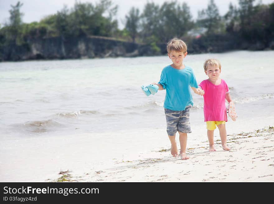 Children walking on beach