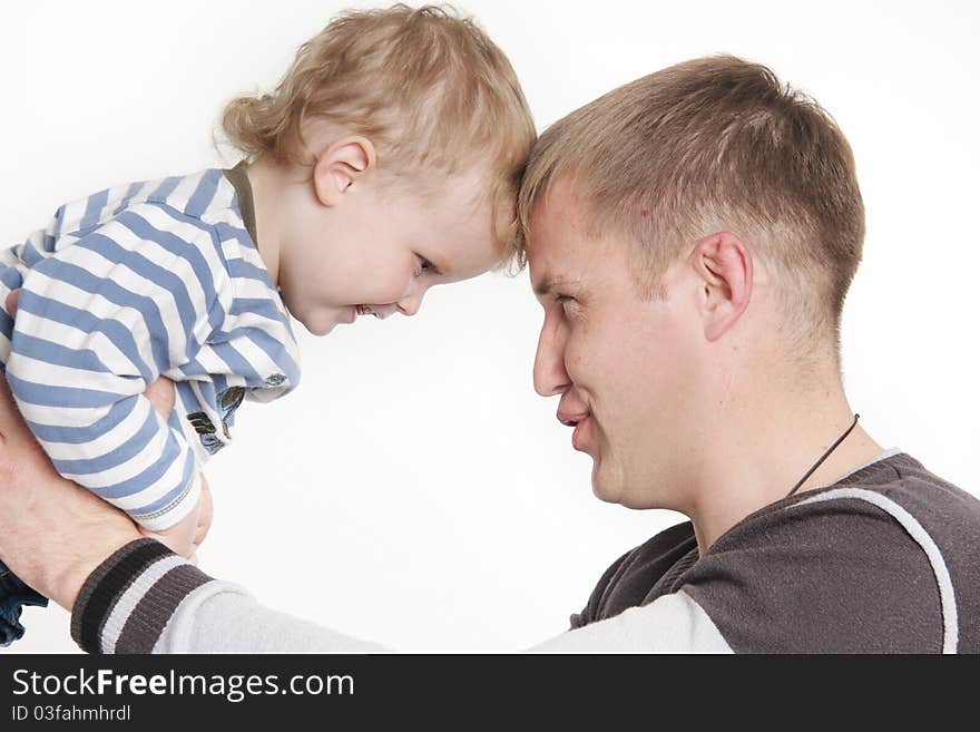 Father and son playing over white