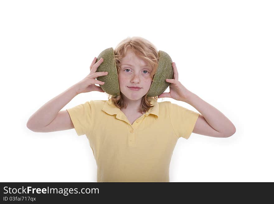 Small girl holds the melons before the ears. Small girl holds the melons before the ears