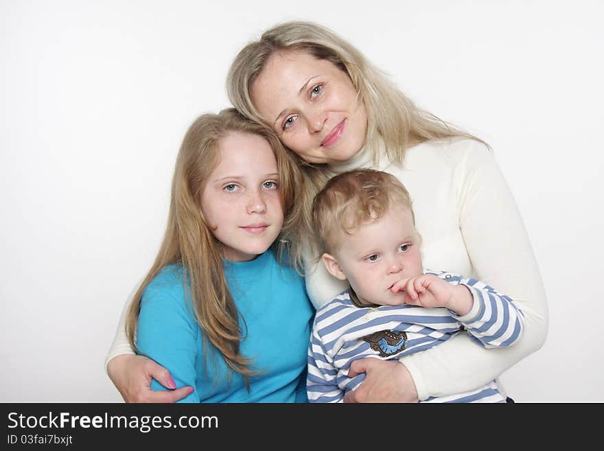 Mother and two children over white