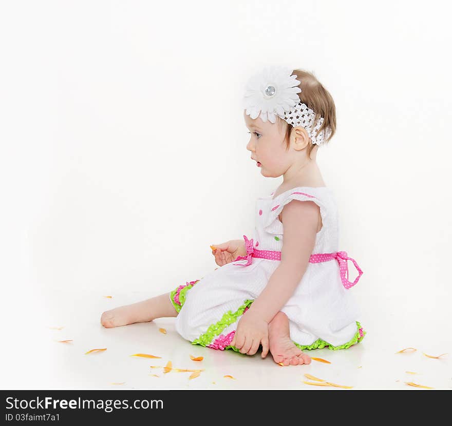 Cute toddler girl with flower over white. Cute toddler girl with flower over white